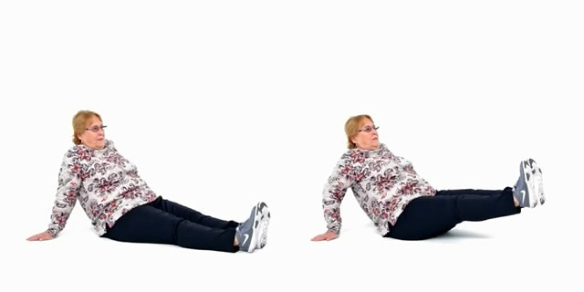 Фото. Упражнения для людей пожилого возраста. Подъем ног на пресс, сидя на полу